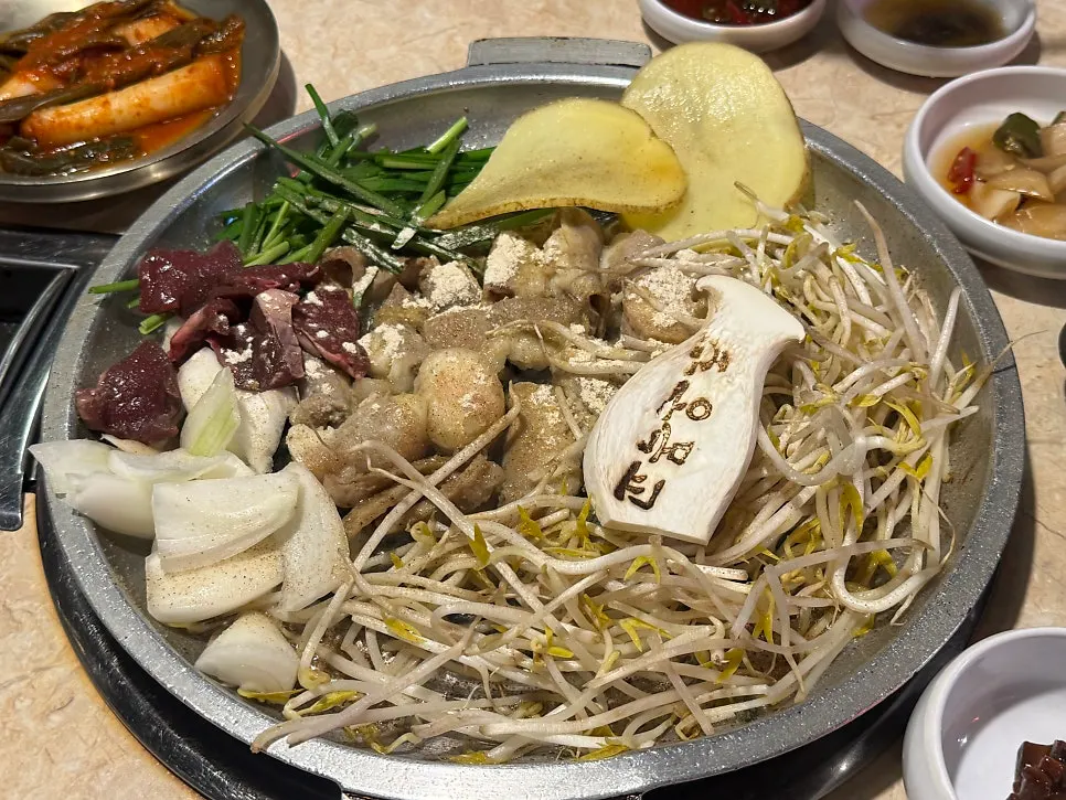 Menu board listing traditional handmade garlic gopchang and mixed gopchang