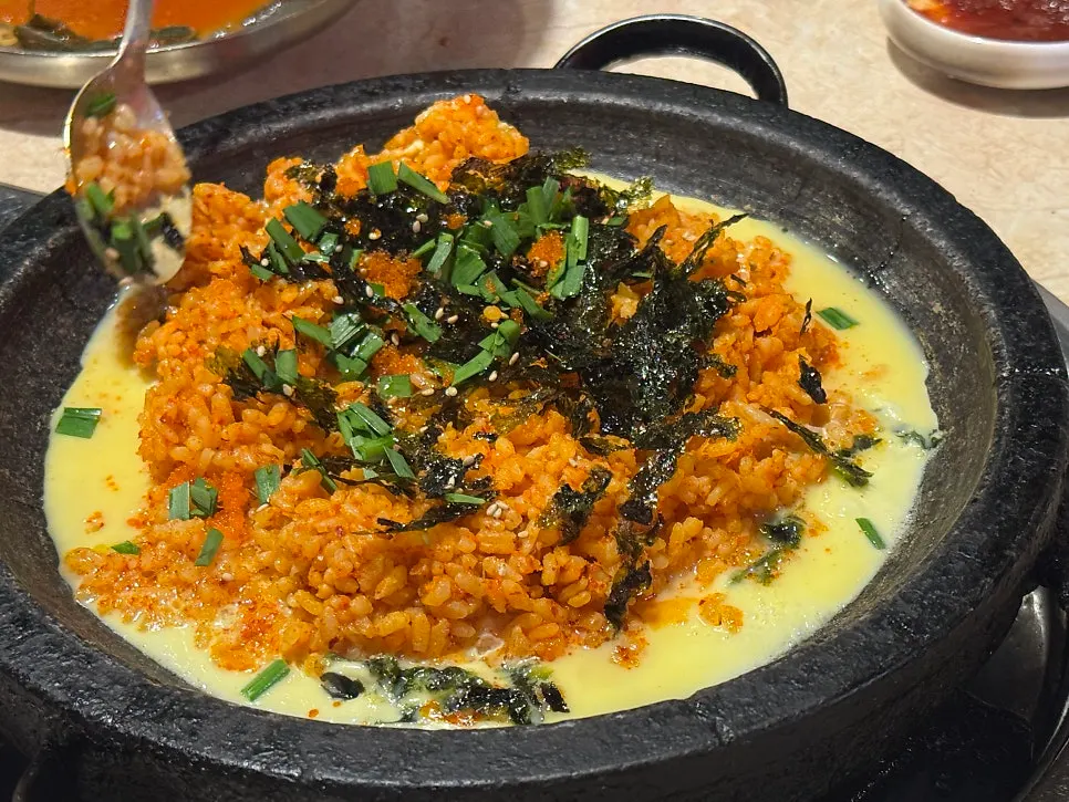 Omokgyo fried rice topped with an egg yolk
