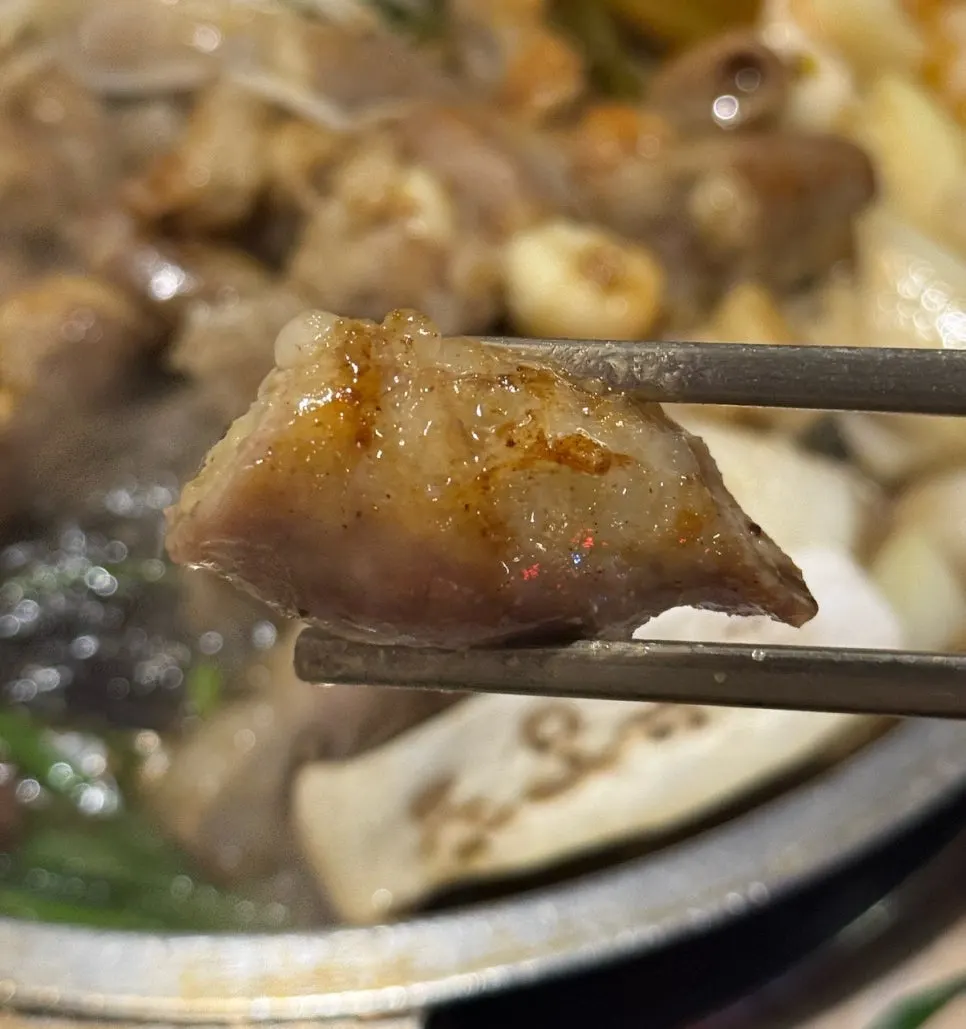 Gopchang and beef heart cooking on the griddle