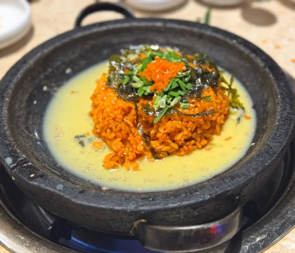 Fried rice served over beaten egg