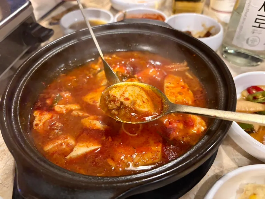 Side dishes, sauces, and sundubu-jjigae spread
