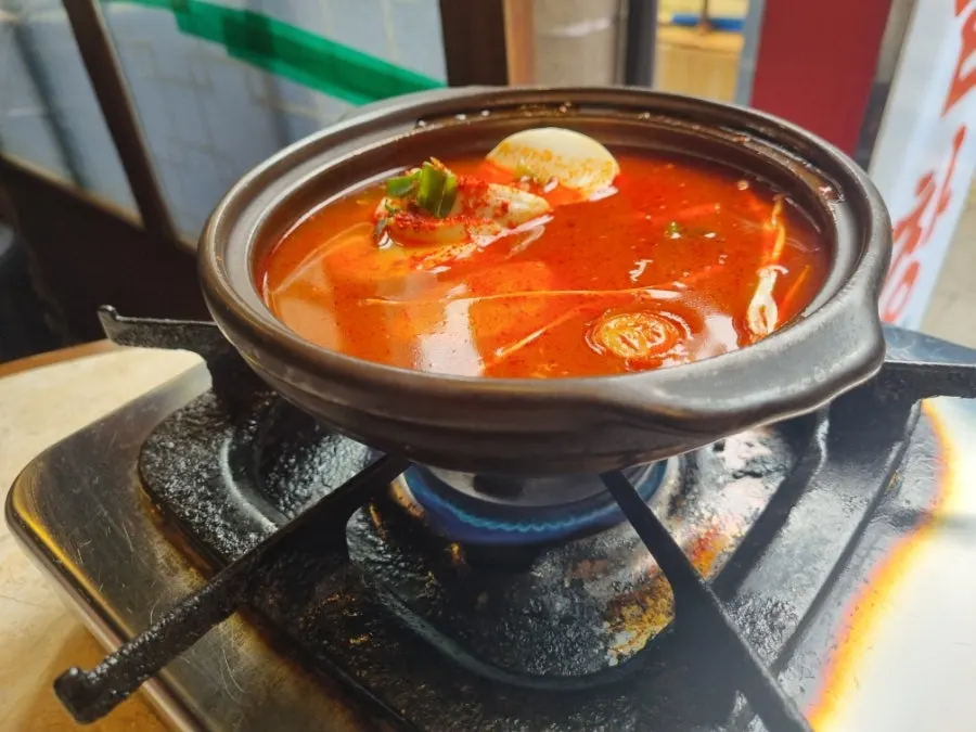 Free sundubu-jjigae served in a stone pot