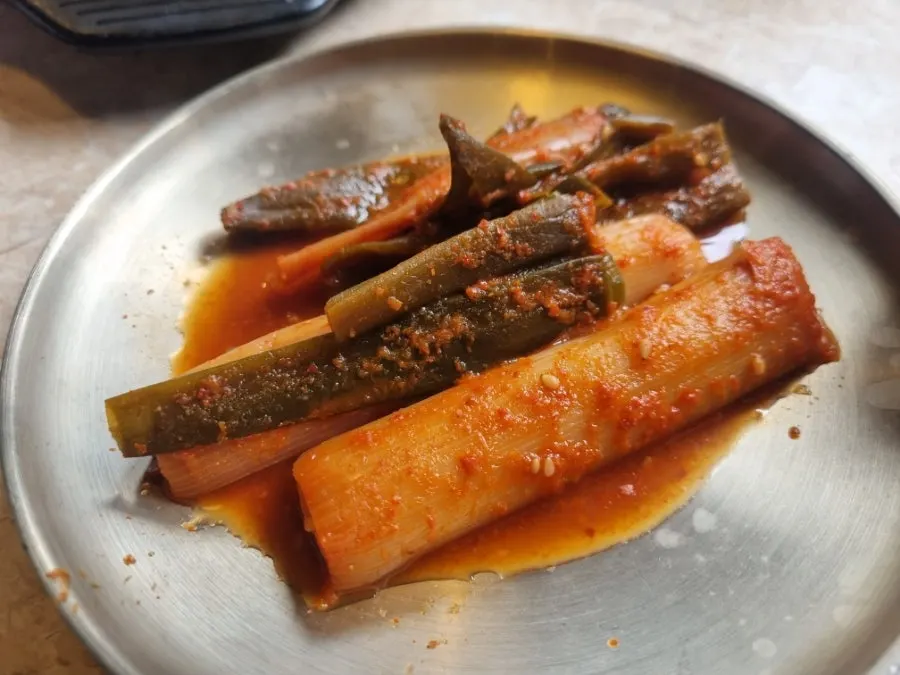 A full spread of Omokgyo Gopchang's basic side dishes