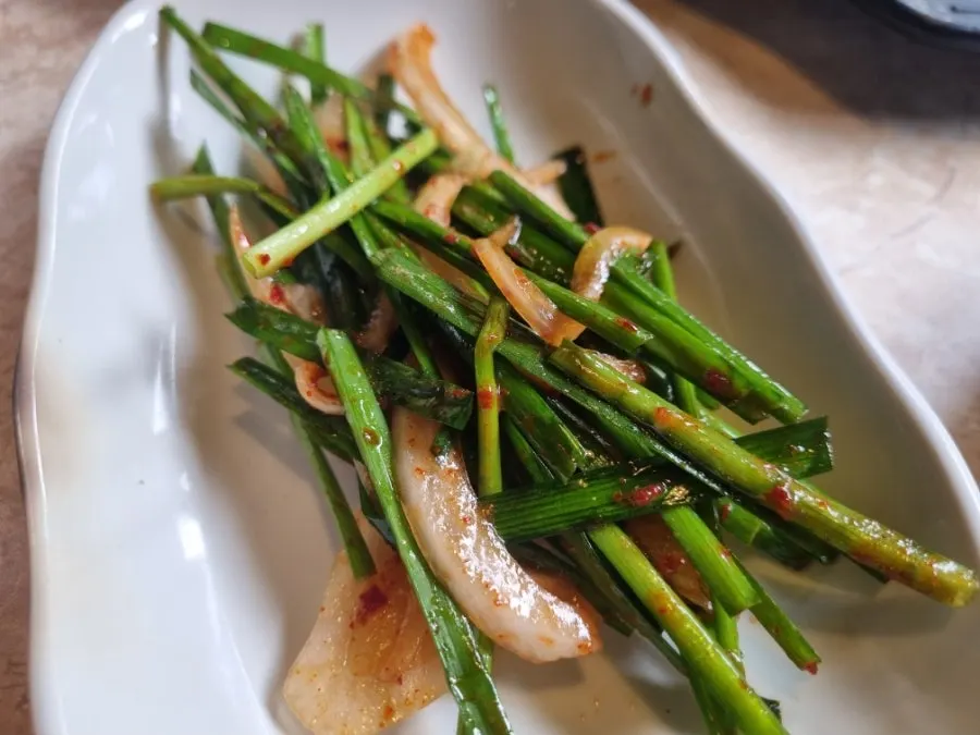Side dishes plated to go with the gopchang