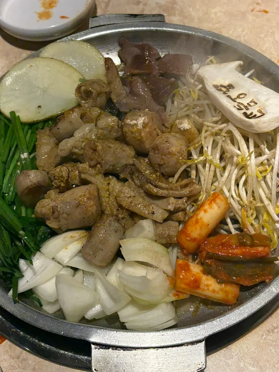 Mixed gopchang cooking on the grill
