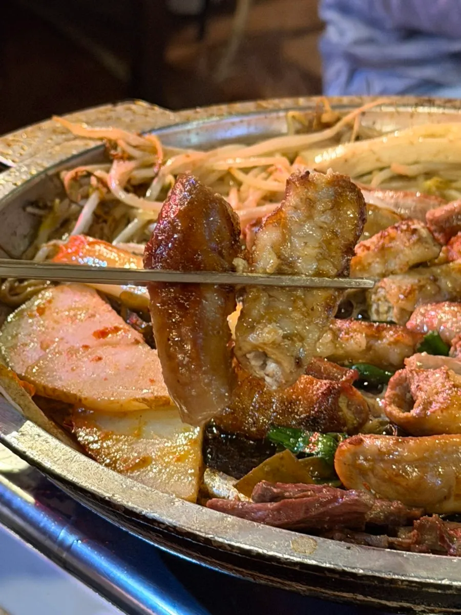 Potatoes turned golden after soaking up gopchang fat