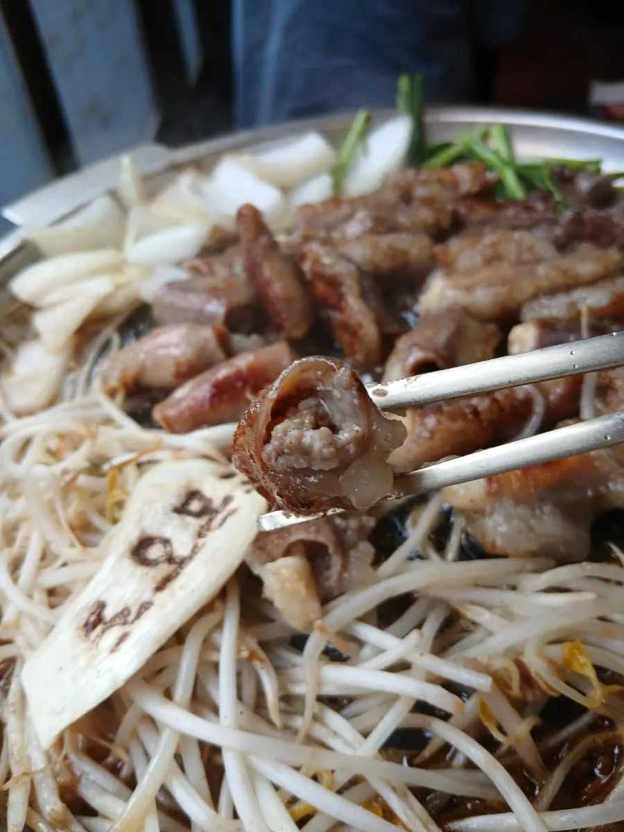 Cross-section of garlic gopchang packed with garlic