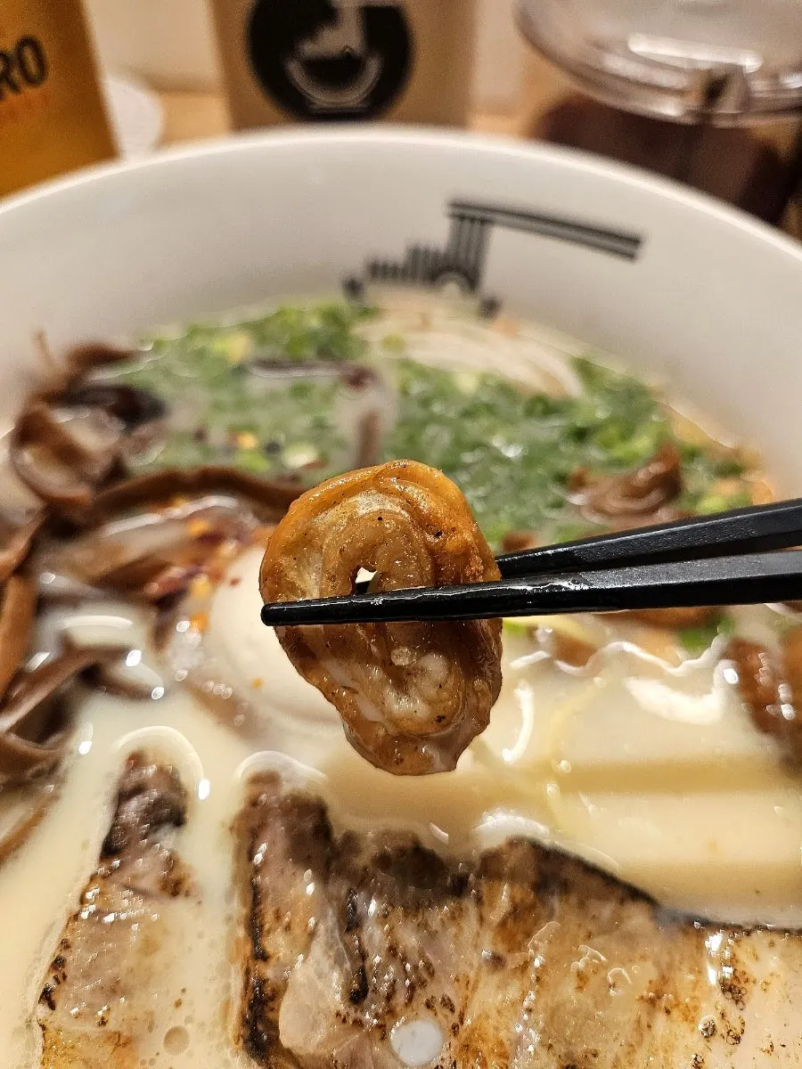 Motsu ramen broth and toppings