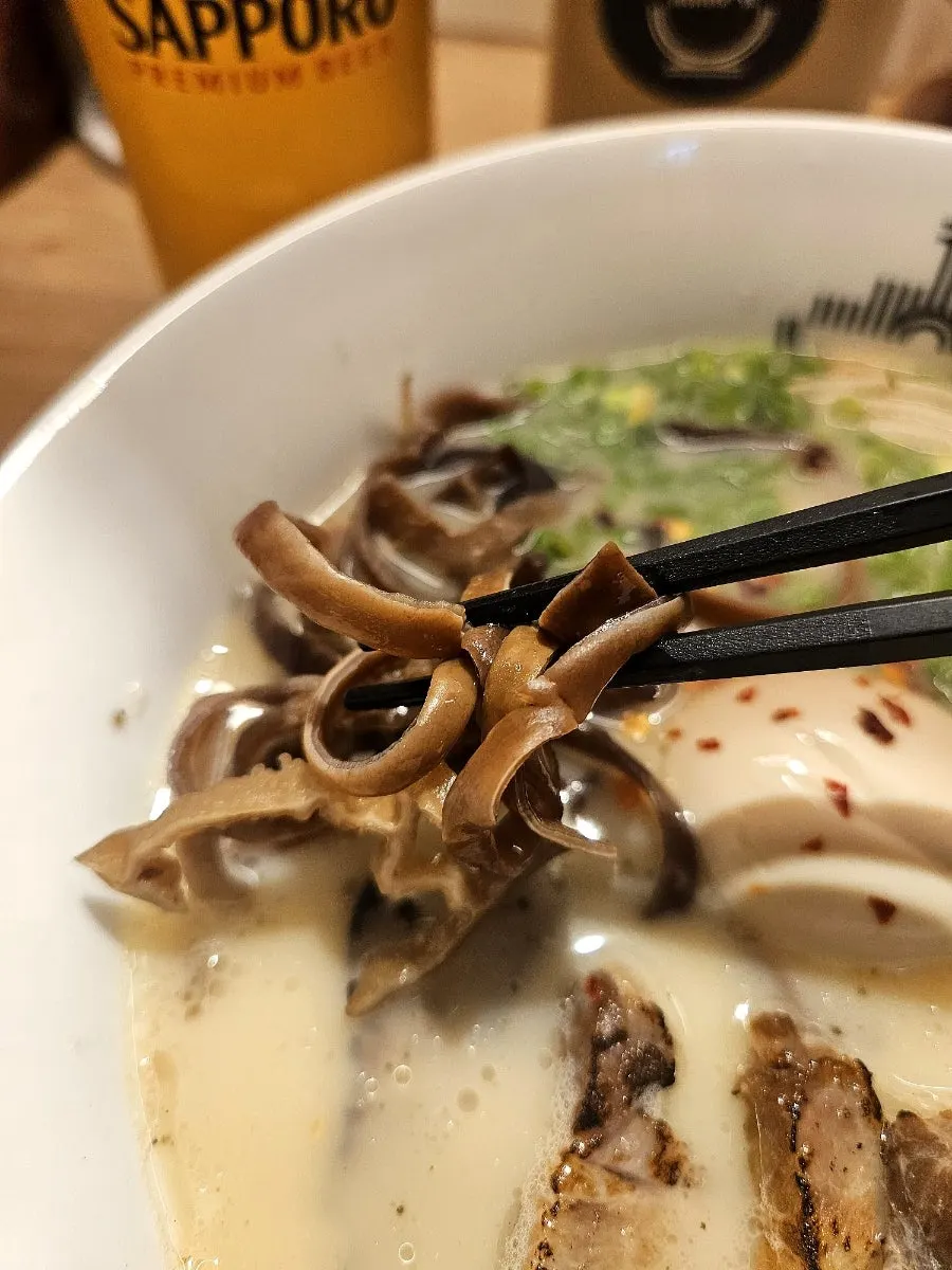 Extra chashu added to motsu ramen