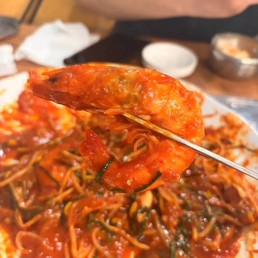 Seafood lifted up with chopsticks