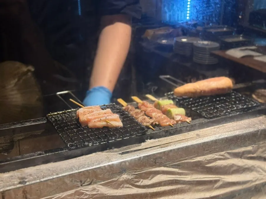 Skewers grilling at the counter