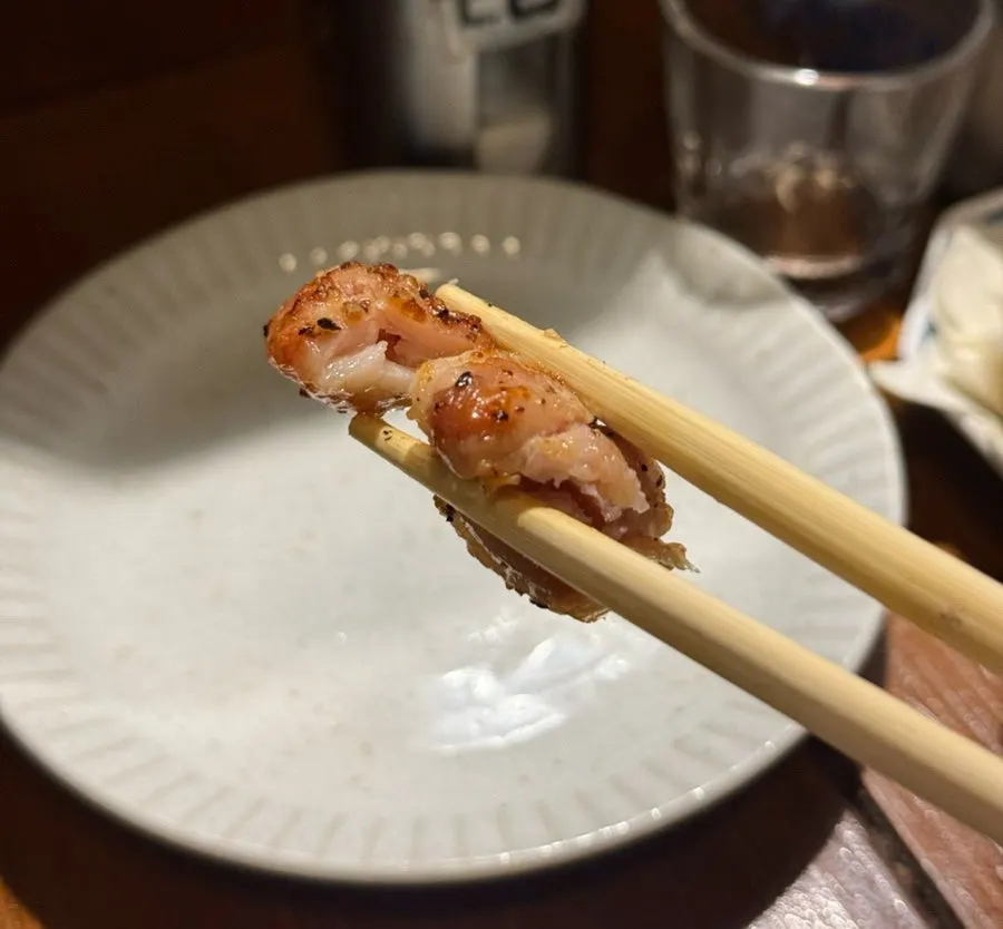Charcoal skewers ordered as snacks for a solo drink