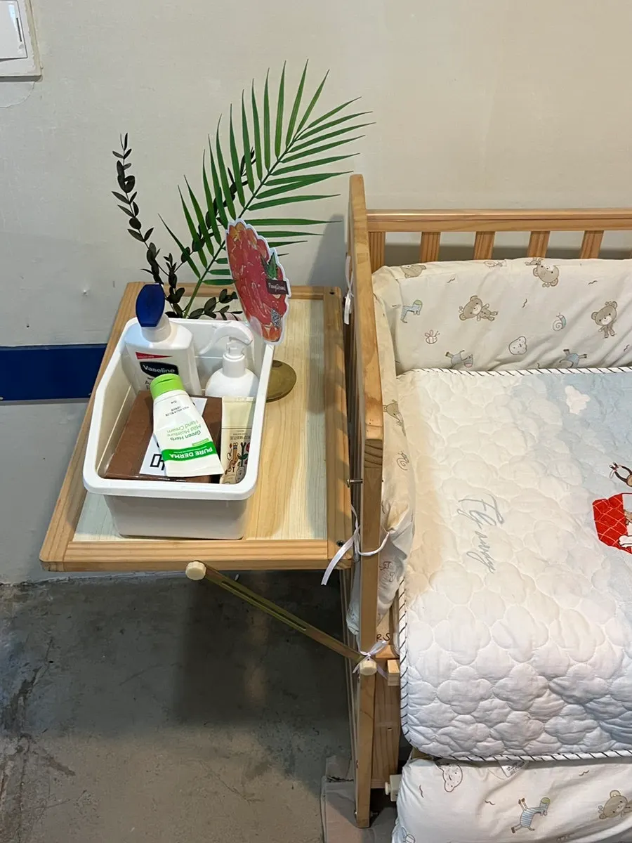 Baby crib set up inside the restroom