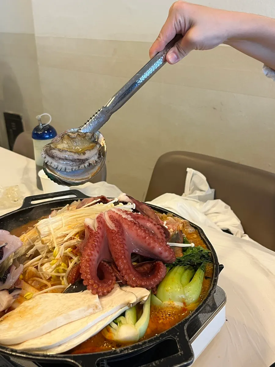 Plump octopus leg on the hotplate