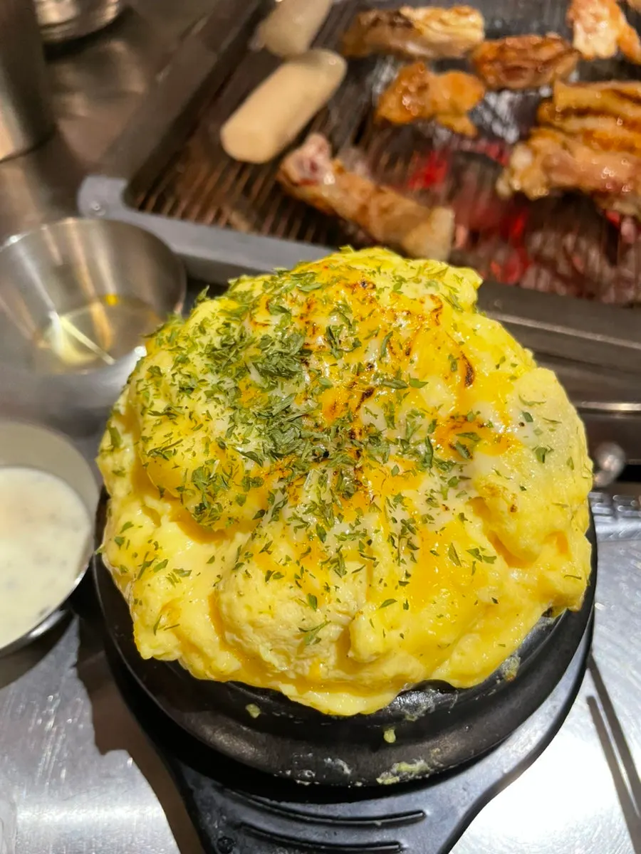 Steamed egg topped with cheese