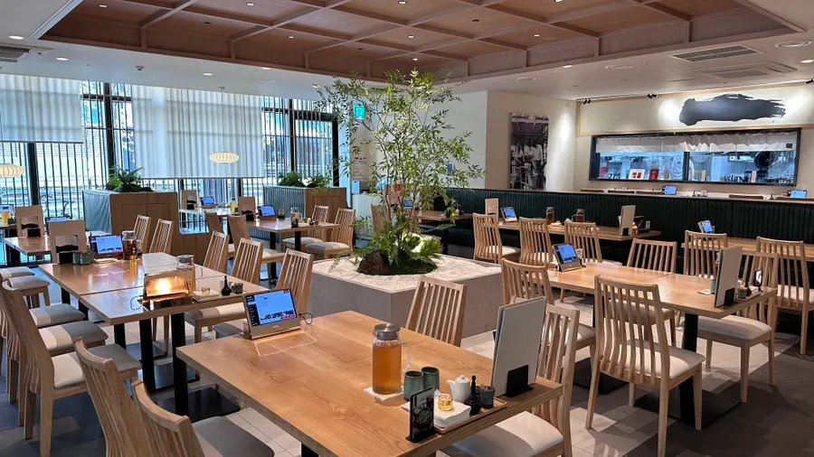 Interior of Kikukawa in wood and green tones