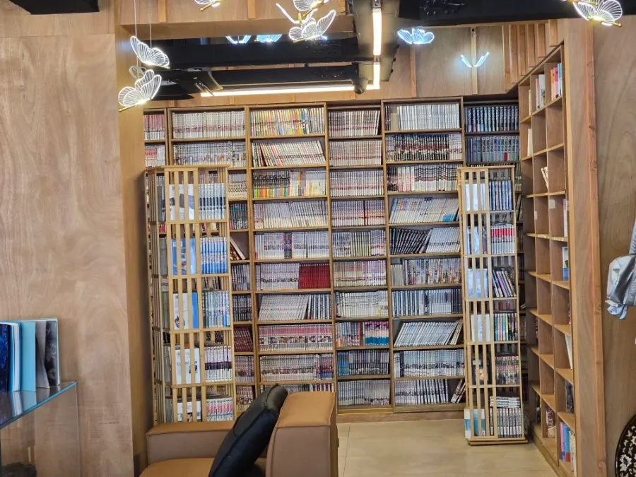 Manga bookshelves arranged along the wall