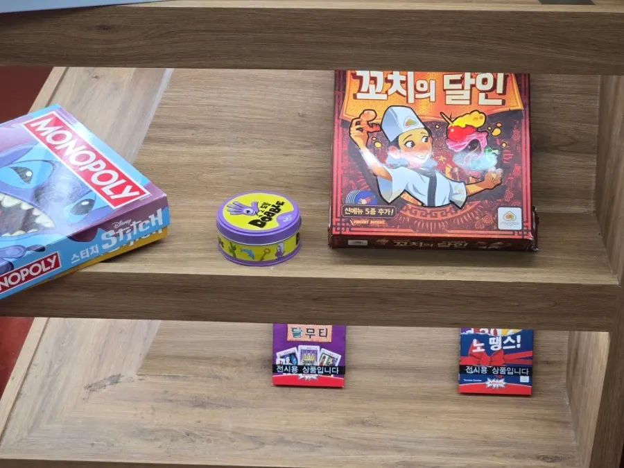 Shelves stacked with a variety of board games