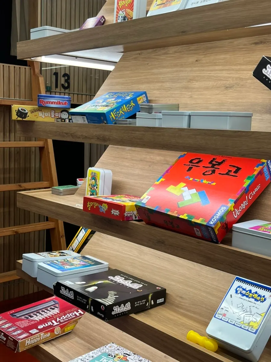 Shelves stacked with hundreds of board games