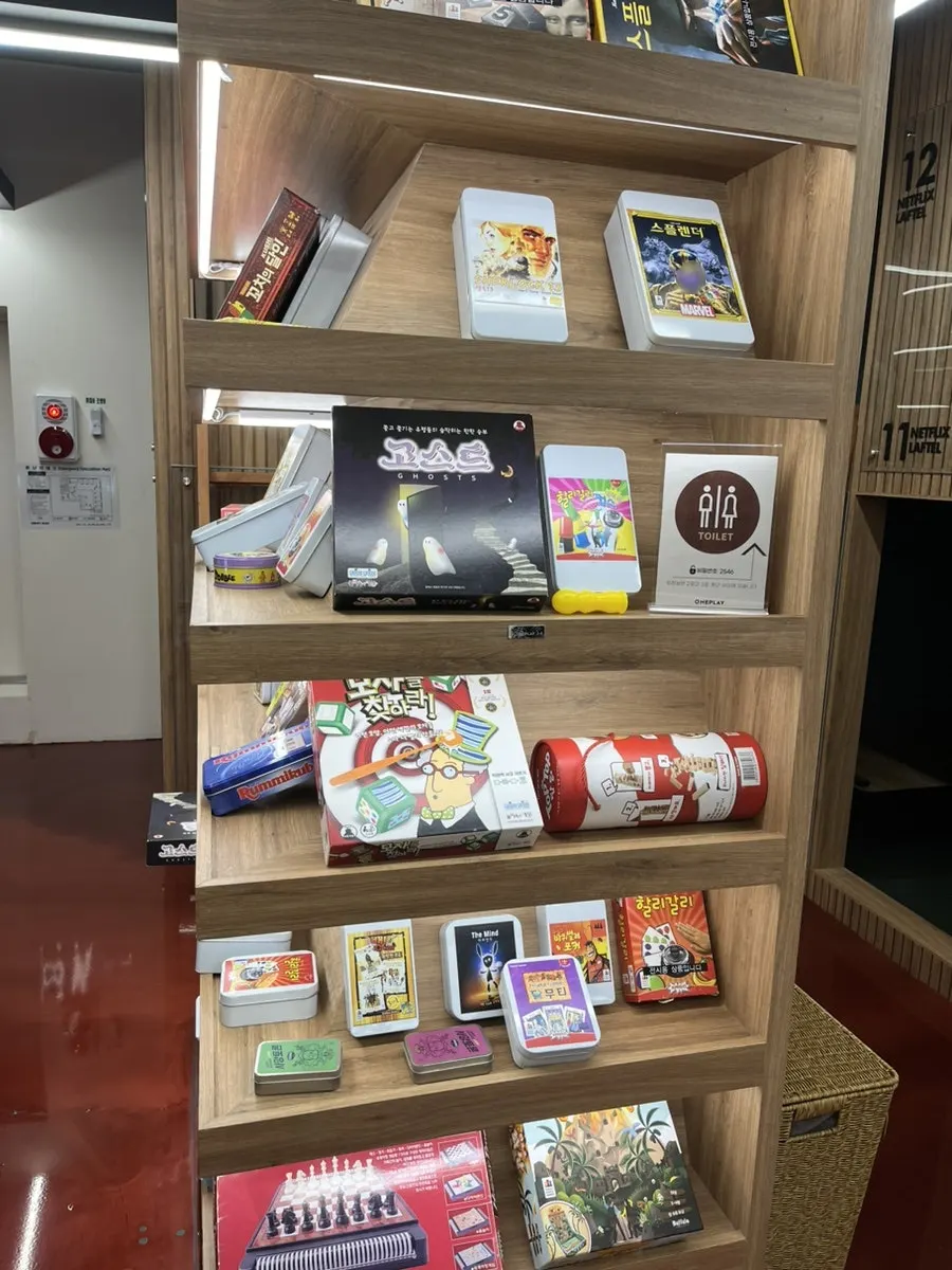 Board game boxes including Ubongo and The Da Vinci Code