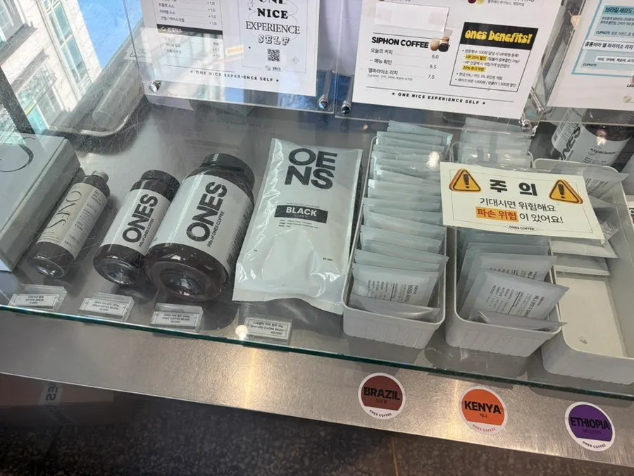 Display shelf of drip bags and whole beans