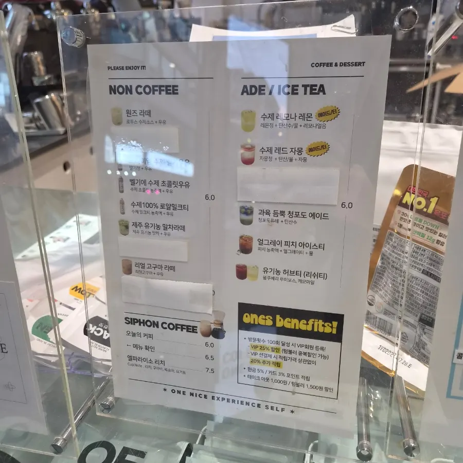 Menu board listing non-coffee drinks, ades, and bingsu