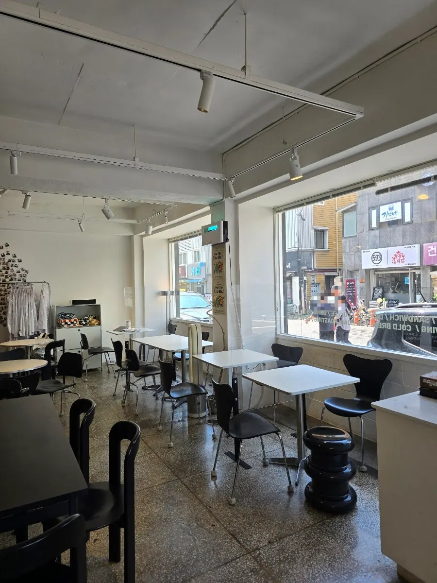 Seating area at Wonz Coffee with large glass windows
