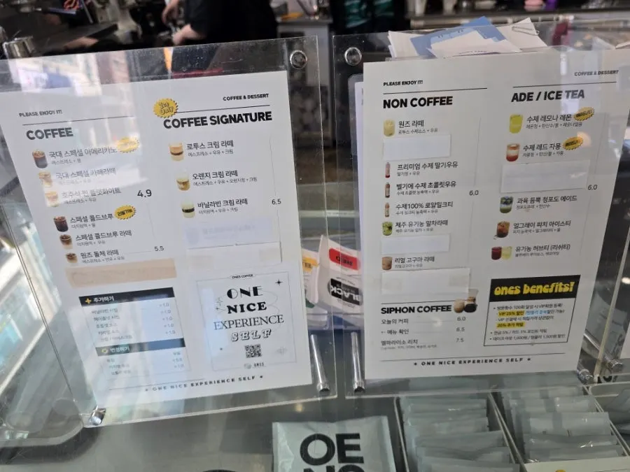 Menu board listing americano and latte prices