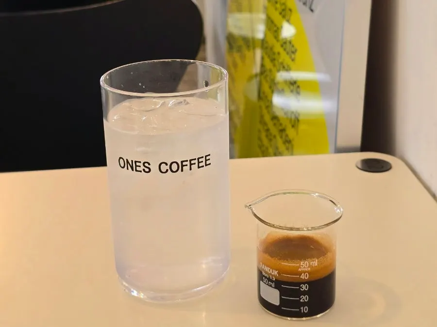 Iced americano served with ice water and shot separately