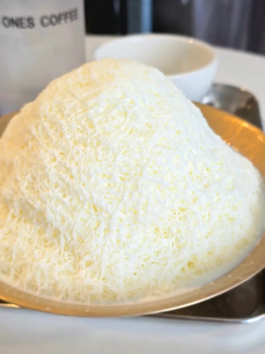 A spoonful of smooth snowflake milk bingsu