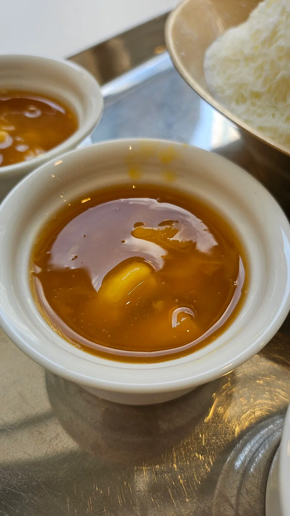 Mango syrup and coconut jelly served on the side