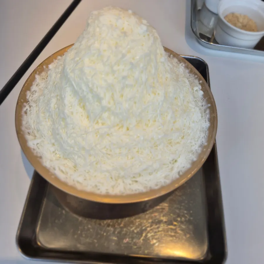 A spoonful scooped from the milk bingsu