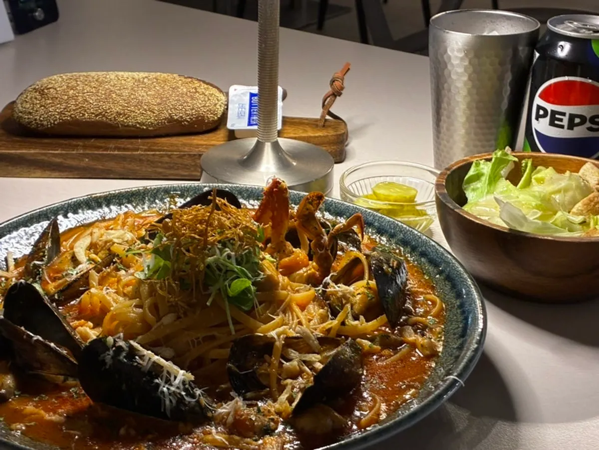 A plate of size-upped seafood arrabbiata