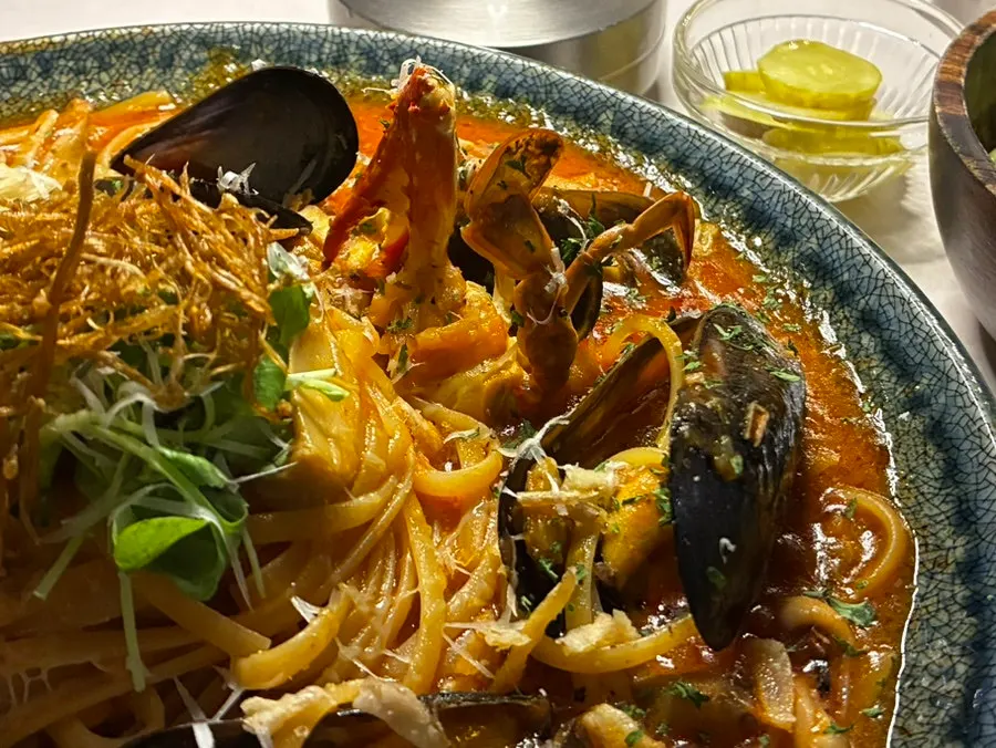 Pasta topped with sprouts and cheese