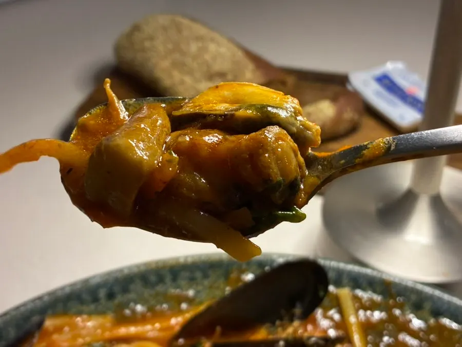 Pasta noodles eaten together with seafood