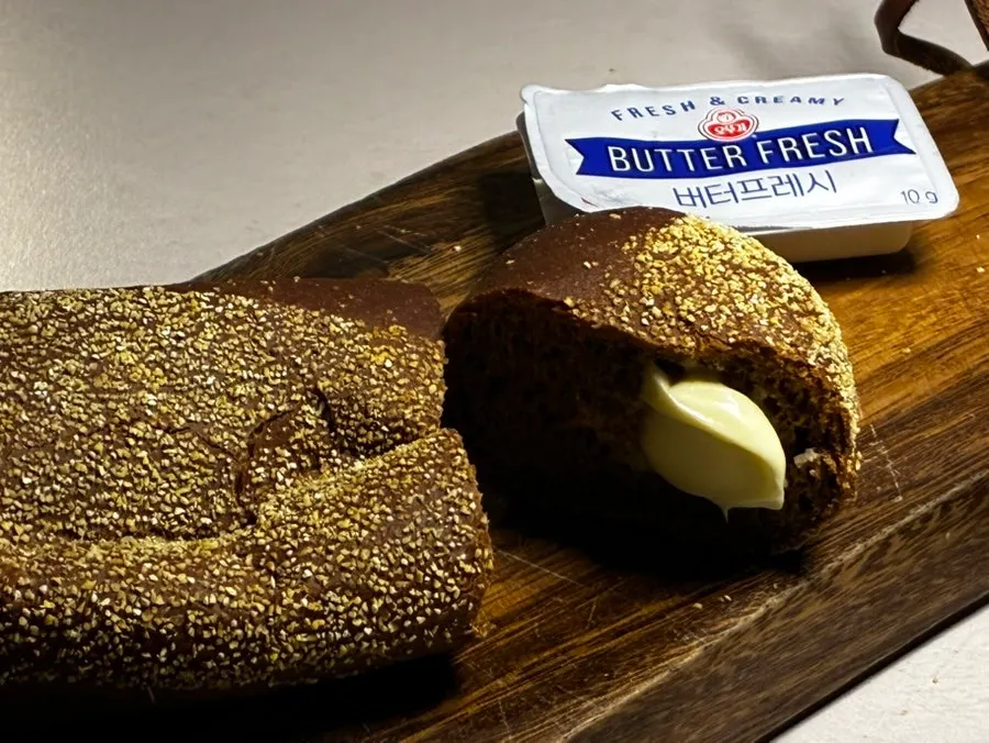 A piece of bushman bread spread with butter