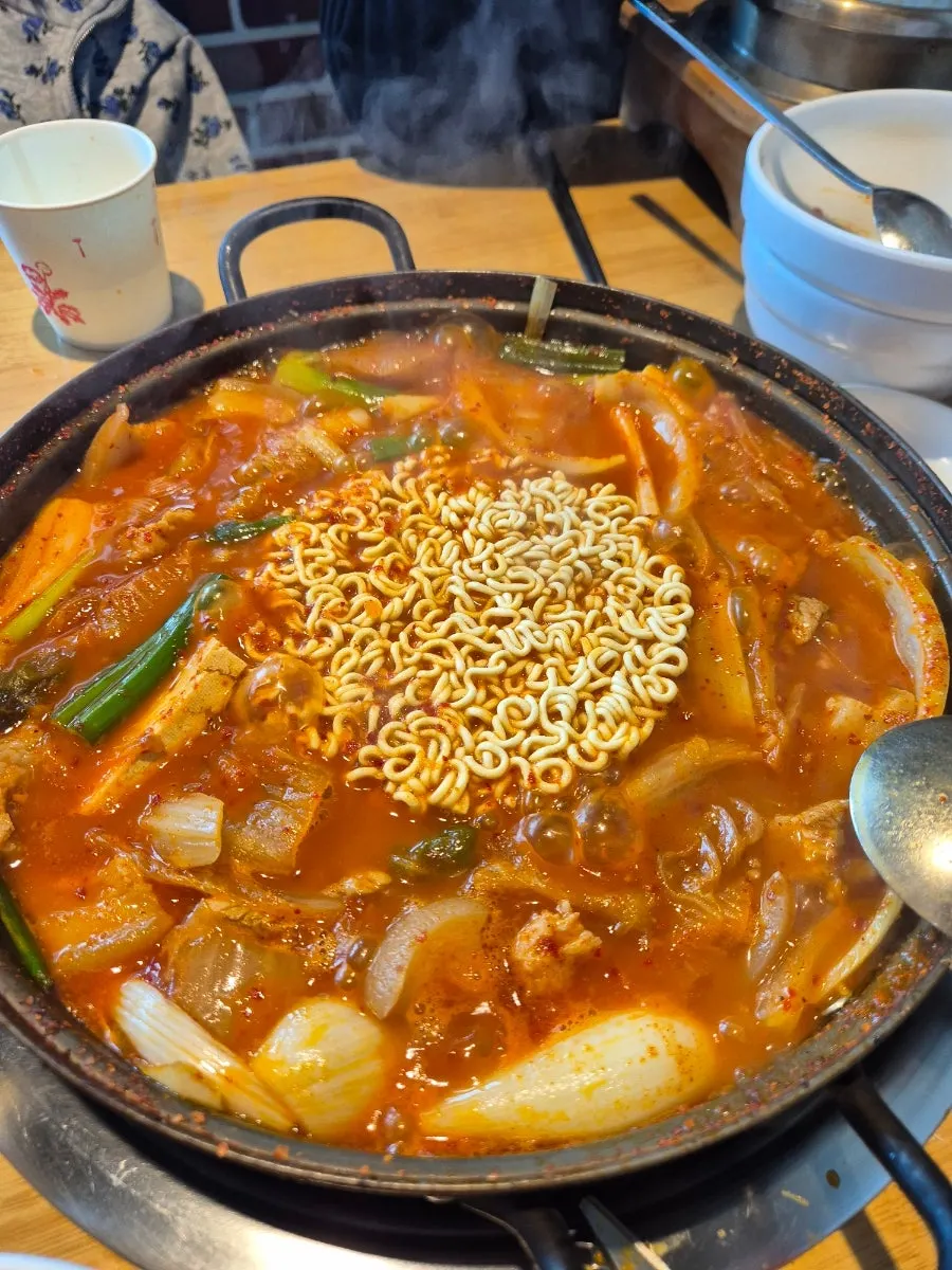 A bite of ramyeon noodles soaked in broth
