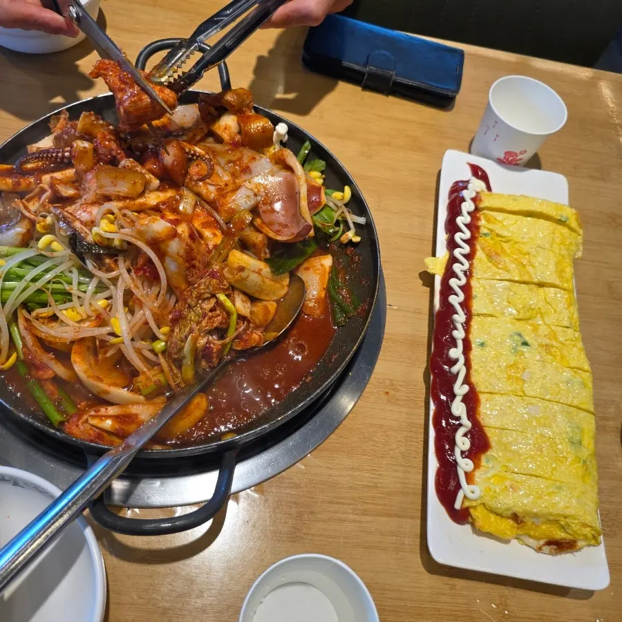 Squid pork duruchigi and cheese king egg roll table spread