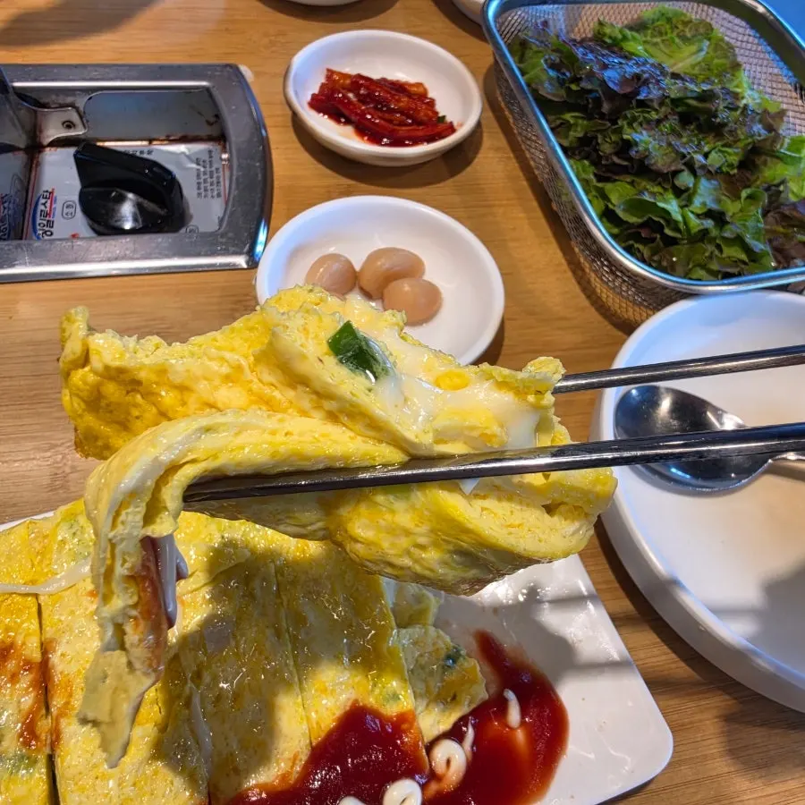Cheese stretching as the egg roll is cut in half