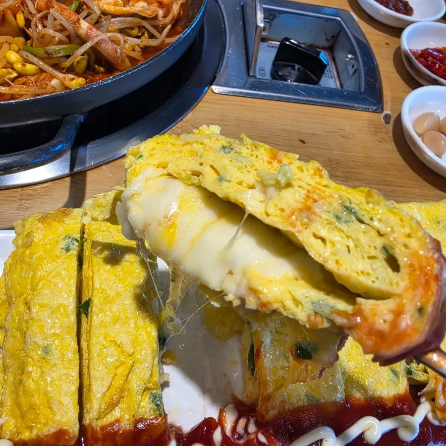 Cross-section of a slice of cheese king egg roll