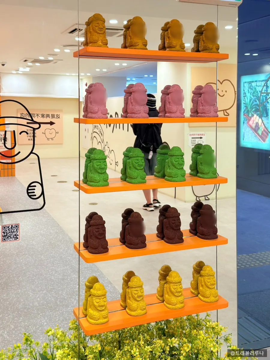 Colorful dol hareubang figures placed throughout the store