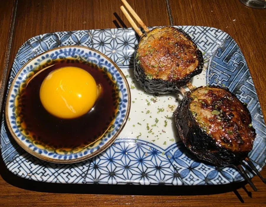 Tsukune chicken meatball skewer ordered with soy sauce
