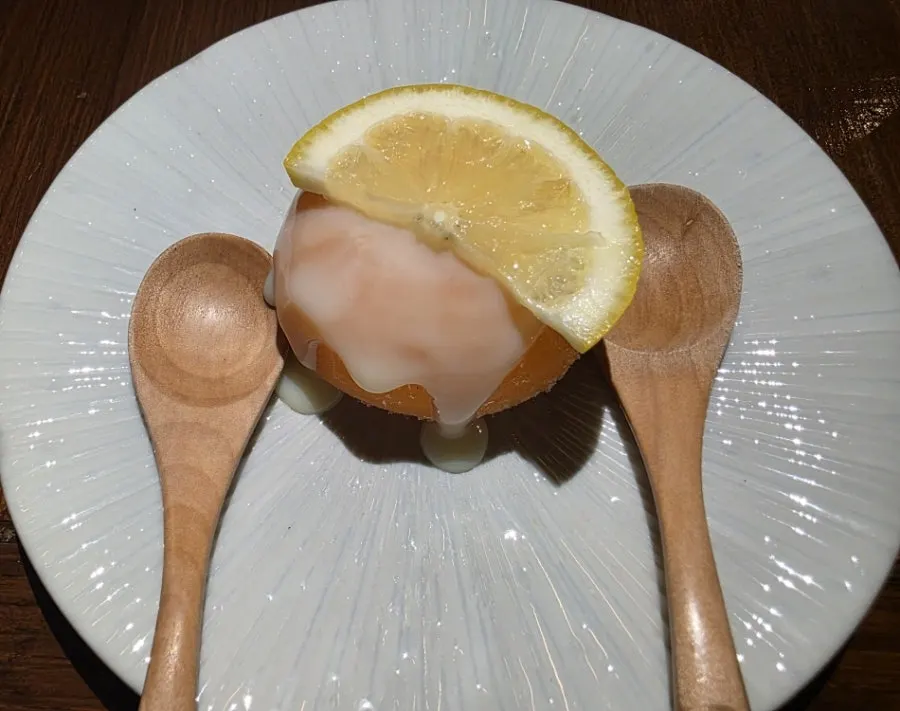 Iced persimmon dessert topped with condensed milk