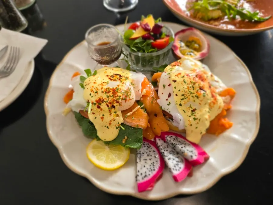 Plate of the signature smoked salmon eggs Benedict