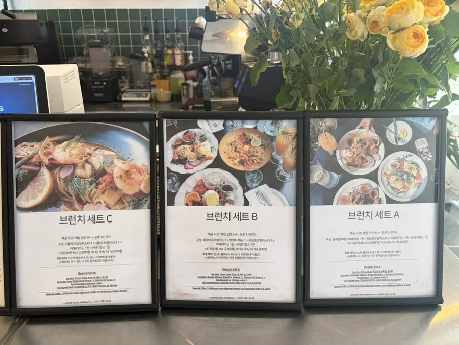 Menu board listing three types of eggs Benedict