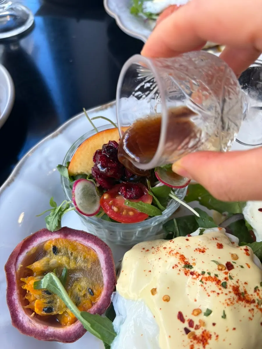 Mini salad and dressing served in glass cups