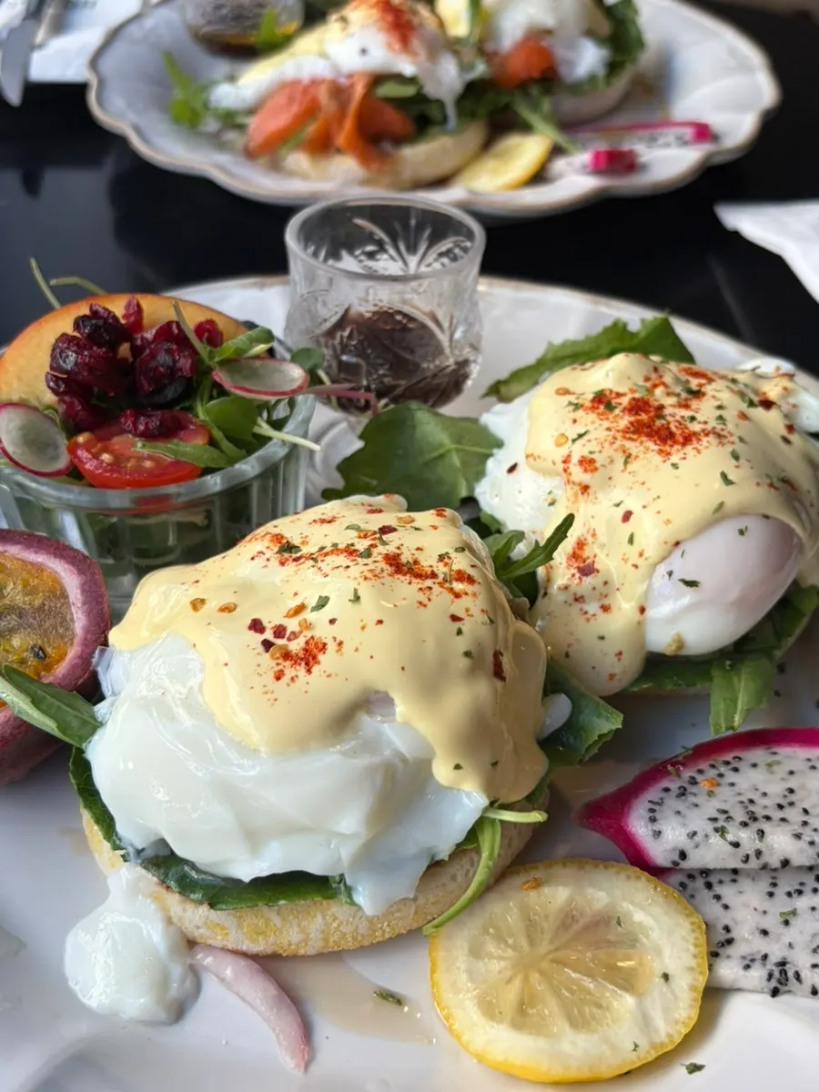 Brunch plate garnished with dragon fruit and passion fruit