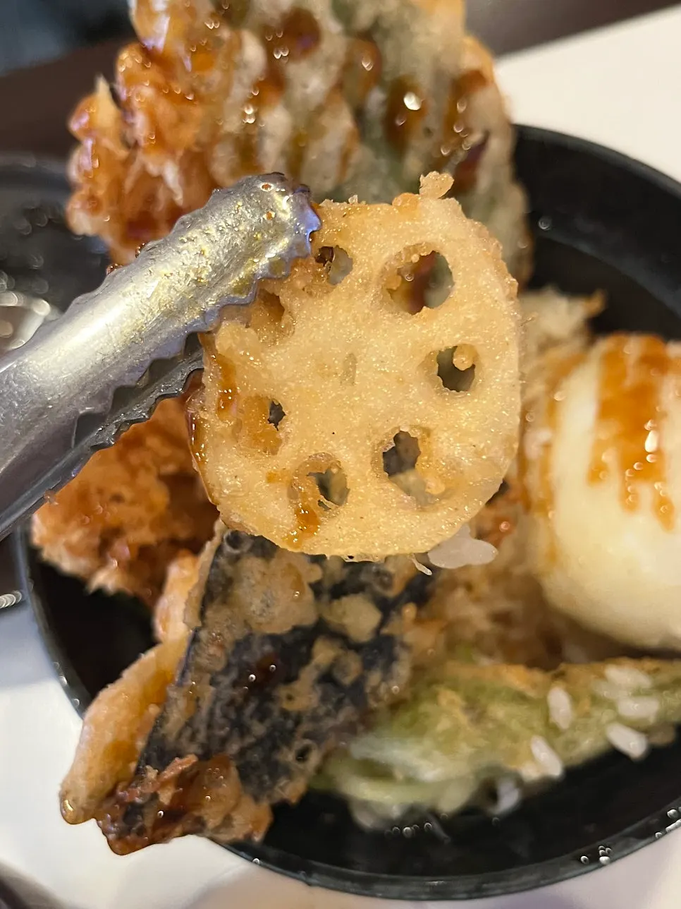 Close-up of tendon topped with shrimp and vegetable tempura
