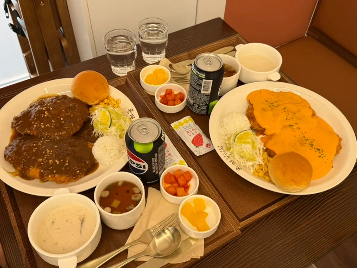 Table setting with curry cutlet and cheddar cheese cutlet