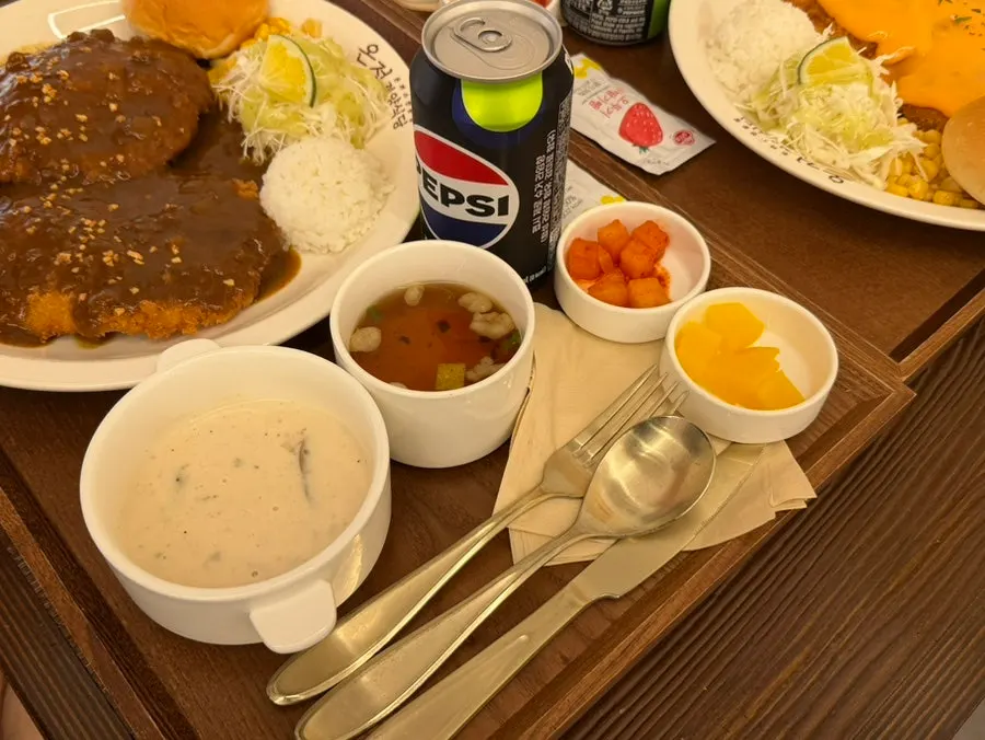 Full spread with soup, broth, and diced radish kimchi